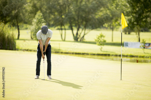 Young man playing golf