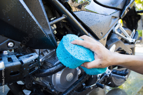 washing black motorcycle