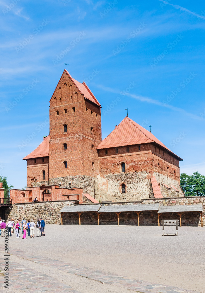 Fototapeta premium Tourists and Trakai Castle. Lithuania