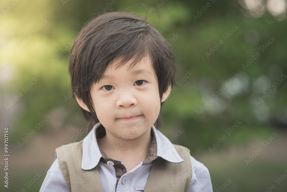 asian boy smiling and looking at camera portrait asian boy smiling and looking at camera portrait