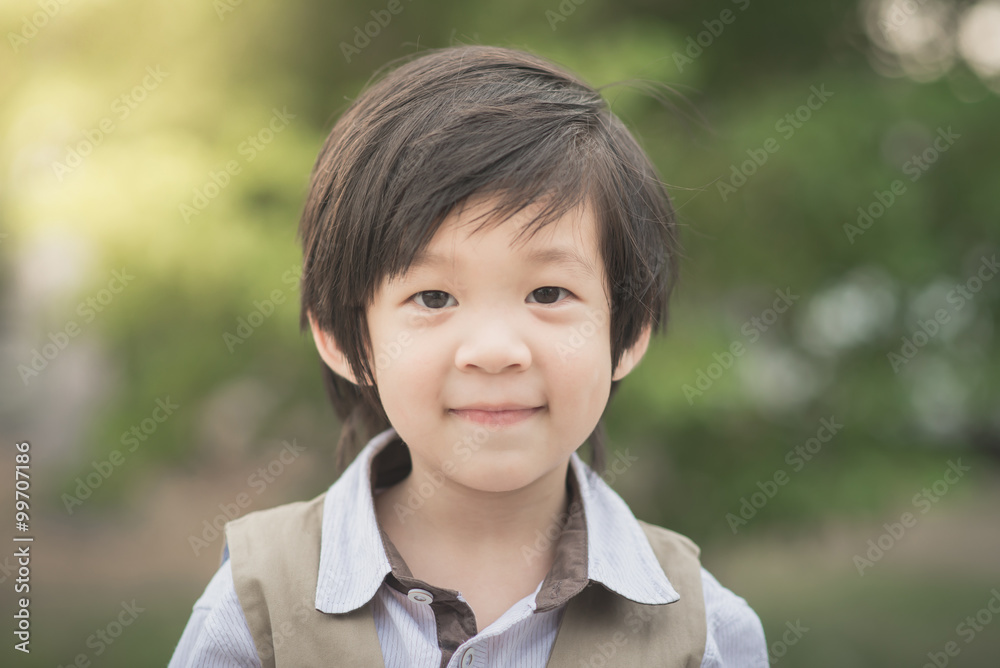 asian boy smiling and looking at camera portrait asian boy smiling and looking at camera portrait