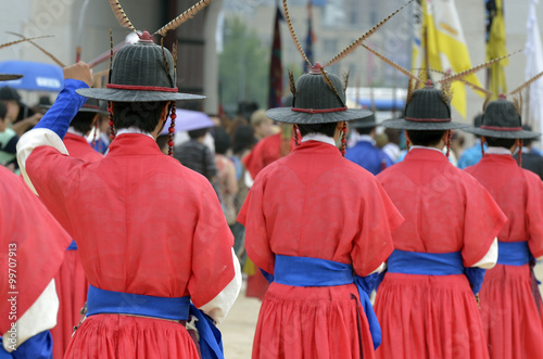 Row of armed guards in ancient traditional soldier uniforms in the old royal residence, Seoul, South Korea.. photo
