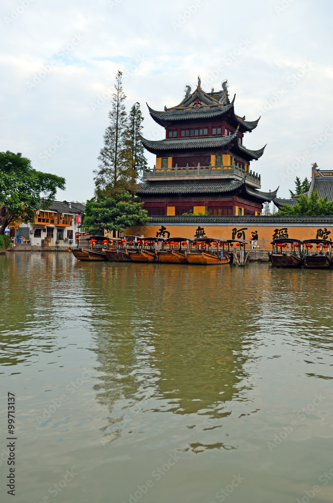 Old village by river in Shanghai with boat..