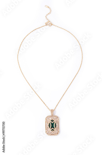 gold pendant with stone on a white background