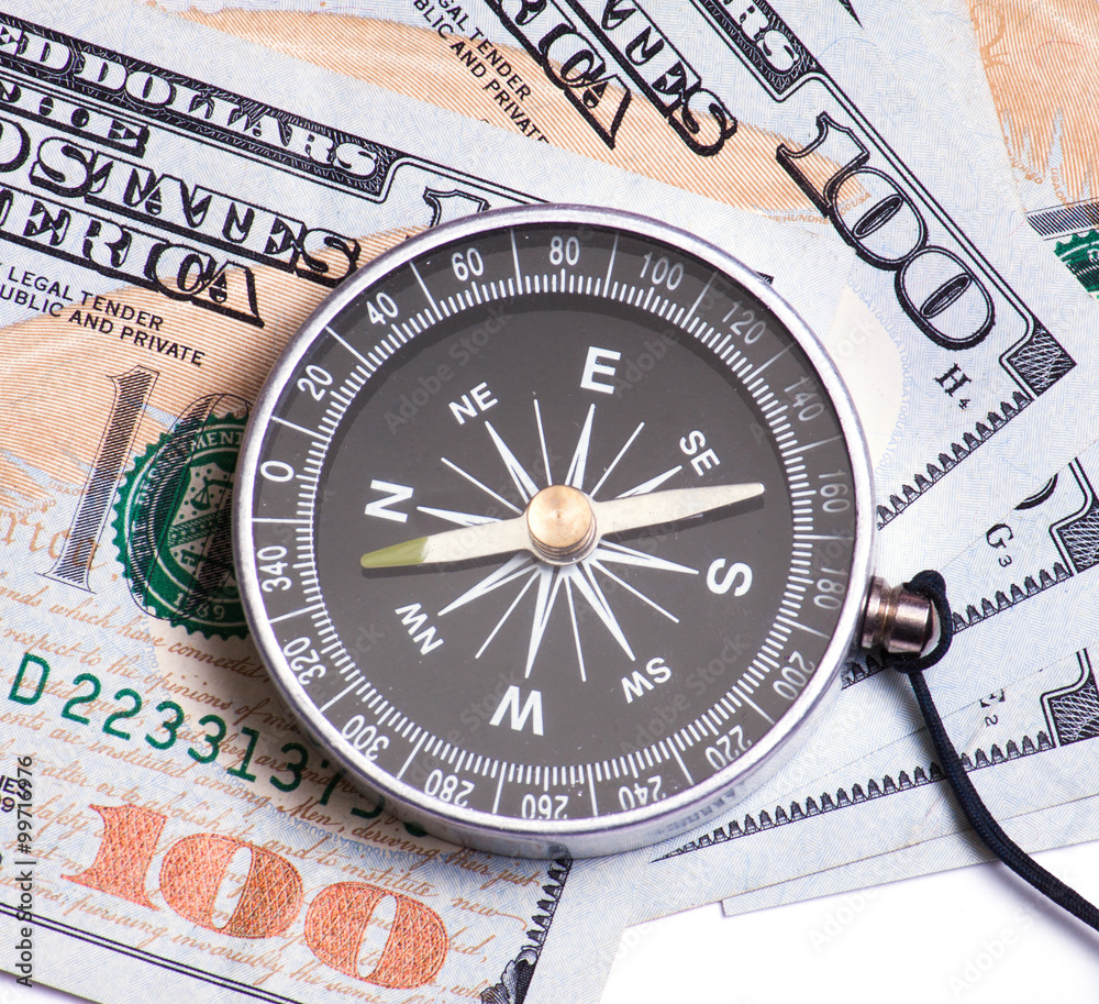 Dollars and compass closeup Dollars and compass closeup