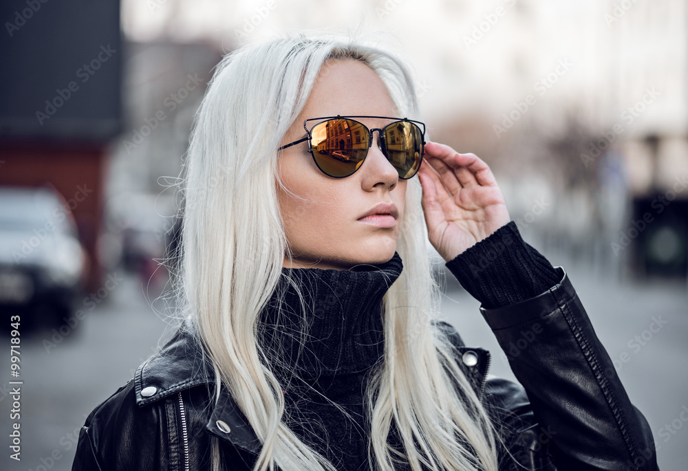 Portrait of beautiful blonde model in sunglasses outdside Portrait of beautiful blonde model in sunglasses outdside