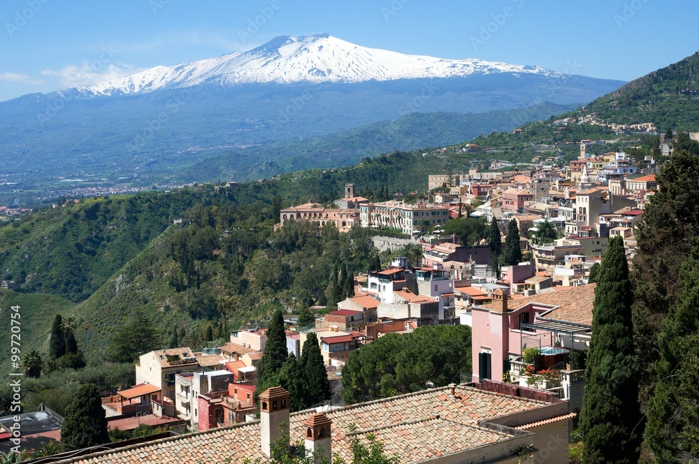 Ancient town Taormina and volcano Etna in the Sicily, Italy