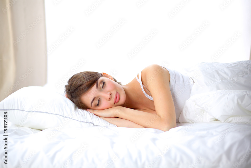 Beautiful girl sleeps in the bedroom, lying on bed Beautiful girl sleeps in the bedroom, lying on bed