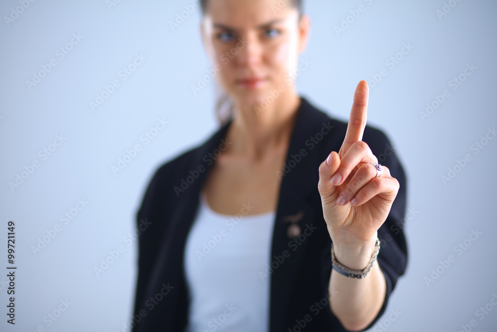 Woman touching an imaginary screen with her finger Woman touching an imaginary screen with her finger