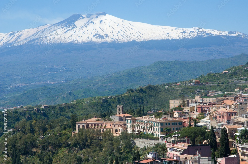 Ancient town Taormina and volcano Etna in the Sicily, Italy