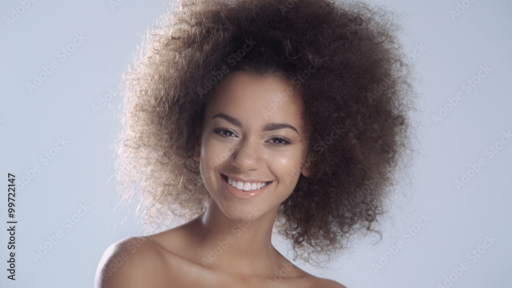 Portrait of a sensual young African woman posing over a white background. Portrait of a sensual young African woman posing over a white background.