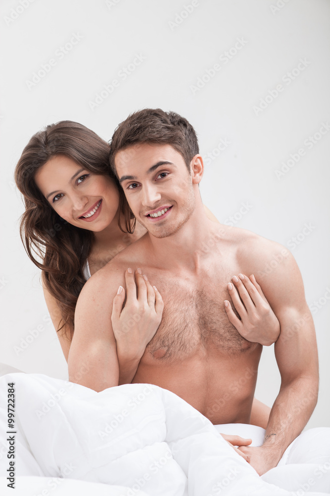 Attractive girlfriend and boyfriend in a bedroom Attractive girlfriend and boyfriend in a bedroom