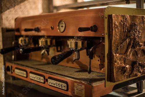 Ancient coffee machine is on the table