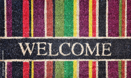 Doorway rug or doormat, welcome, natural fibers, background, toned image
