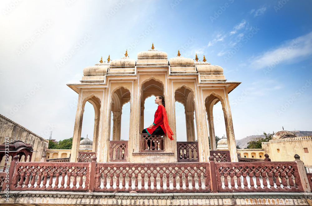 Fototapeta premium Woman on balcony in Palace of Rajasthan