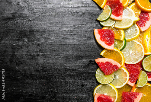 Slices of citrus fruits - grapefruit, orange, tangerine, lemon, lime .