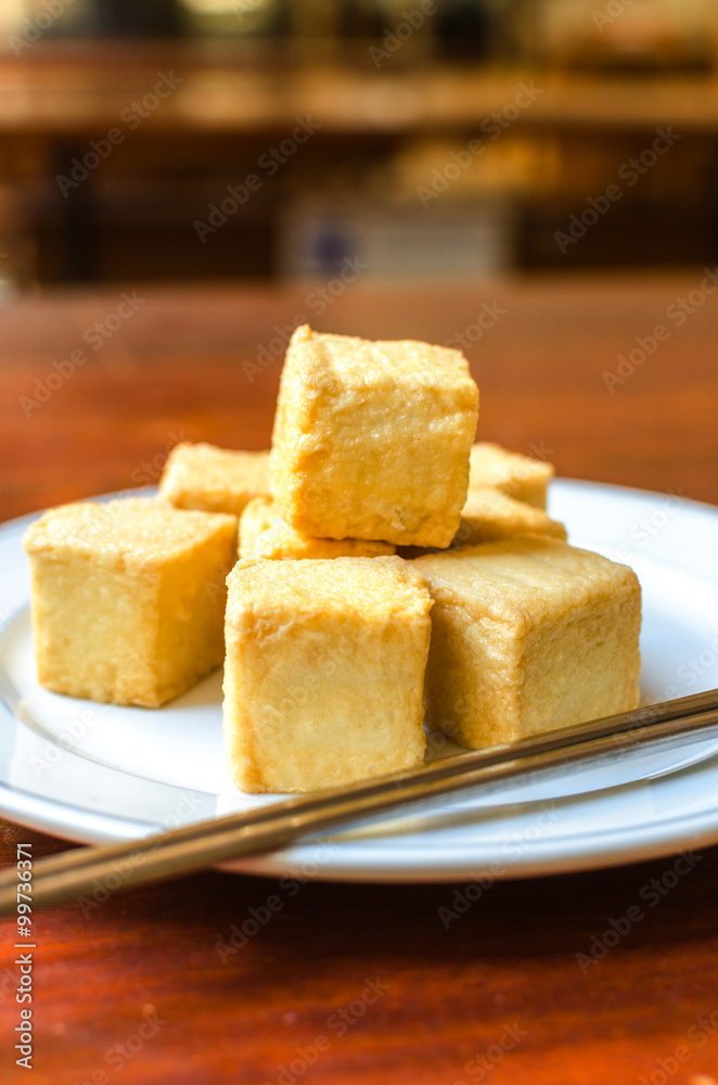 fish Tofu in the plate on a wooden table
