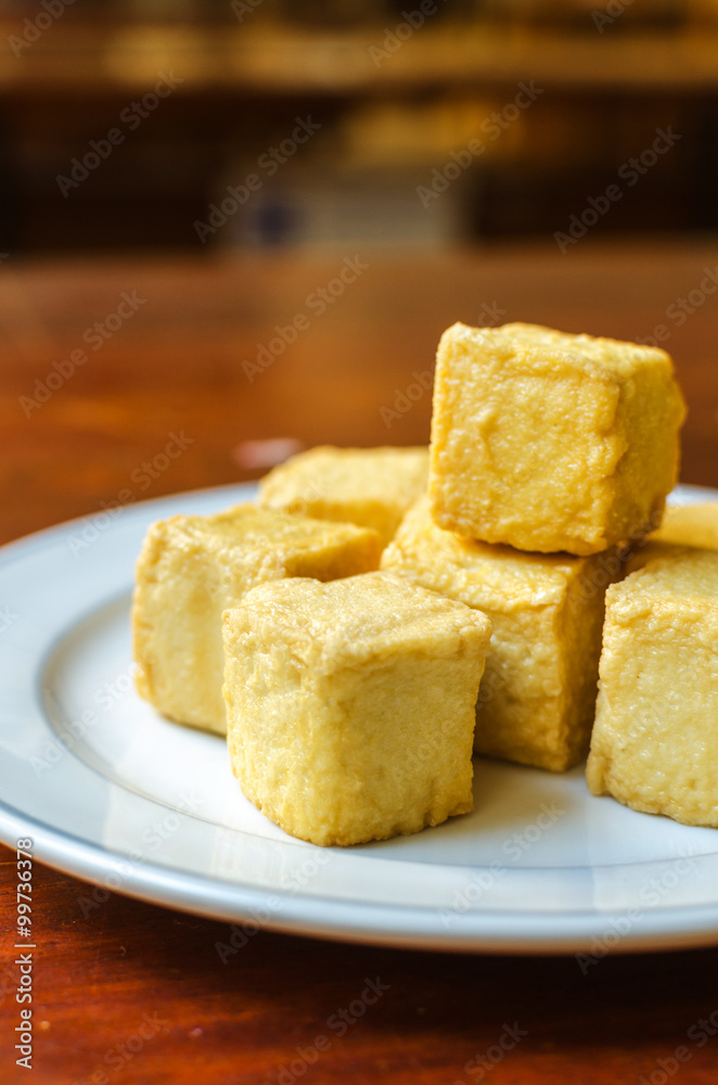 fish Tofu in the plate on a wooden table