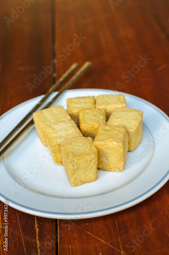 fish Tofu in the plate on a wooden table