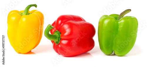colored peppers over white background