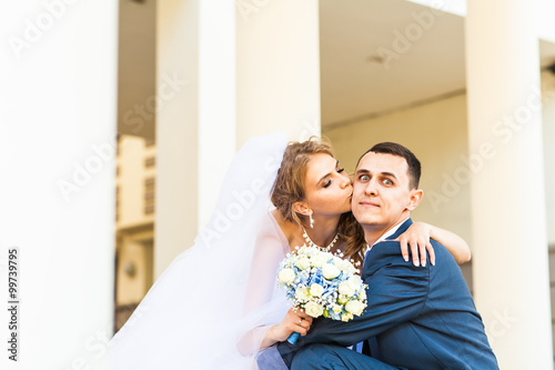 wedding pair hugging and kissing