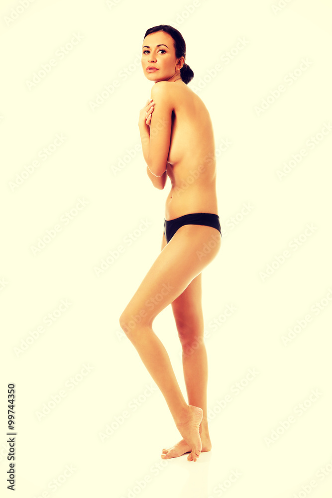 Topless woman covering her breast Topless woman covering her breast