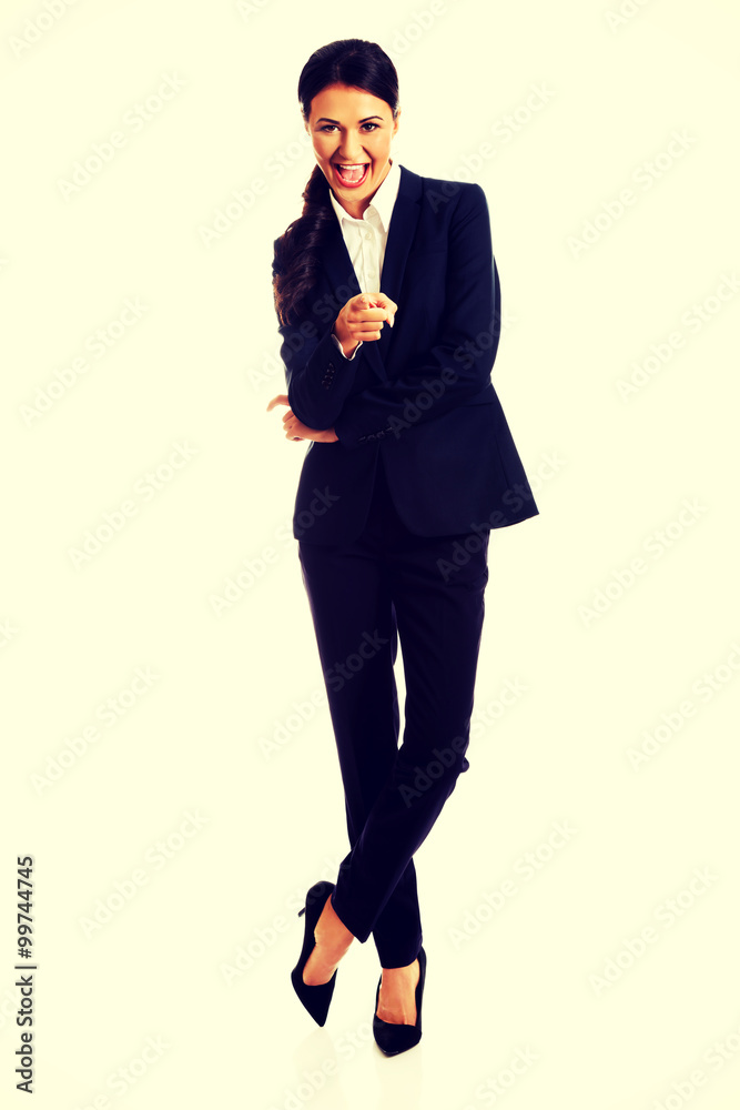 Businesswoman pointing at you Businesswoman pointing at you