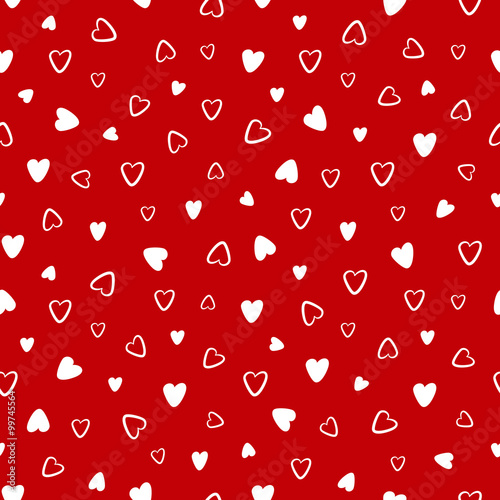Seamless pattern with hand drawn hearts on a red background
