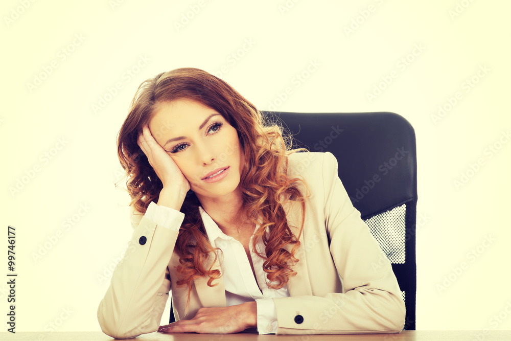 Worried businesswoman at the desk. Worried businesswoman at the desk.