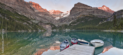 Slika na platnu sunset on mountain lake and canoes