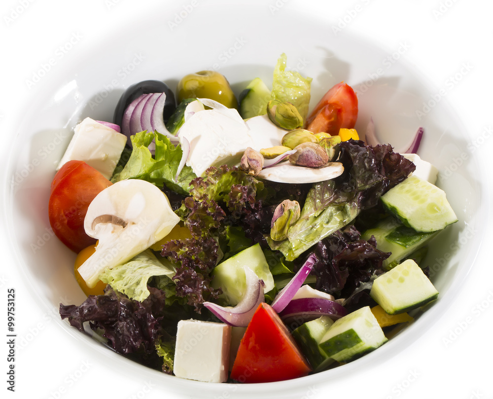 Greek salad on a white background in the restaurant Greek salad on a white background in the restaurant