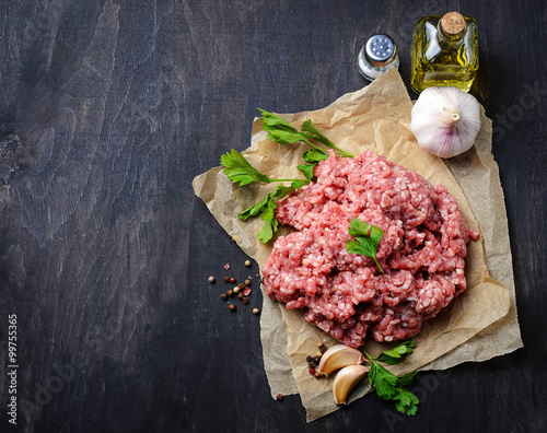 Raw minced meat with olive oil and garlic photo