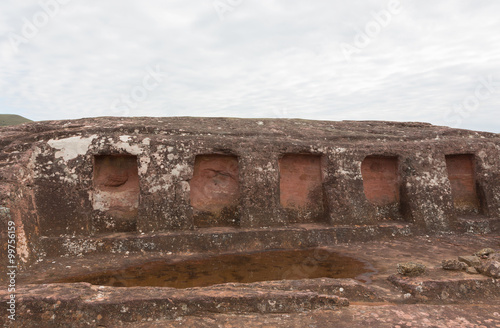 Close-up view of the niches cut in the rock in El Fuerte de Samaipata (Fort Samaipata) photo