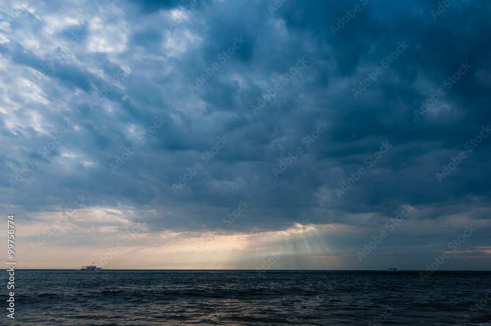 Stormy sky over ship in the sea