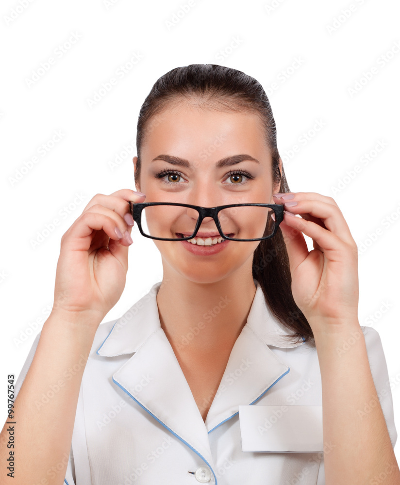 Portrait of a brunette doctor handing out glasses smiling into the camera Portrait of a brunette doctor handing out glasses smiling into the camera