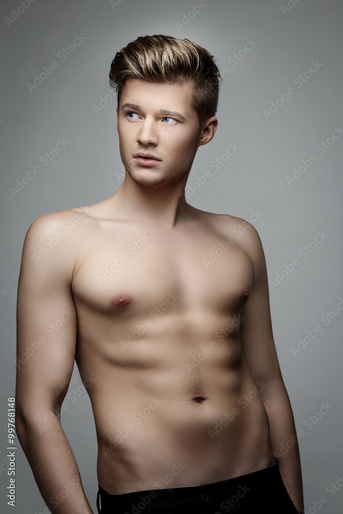 Fototapeta premium Elegant young handsome man. Studio fashion portrait.