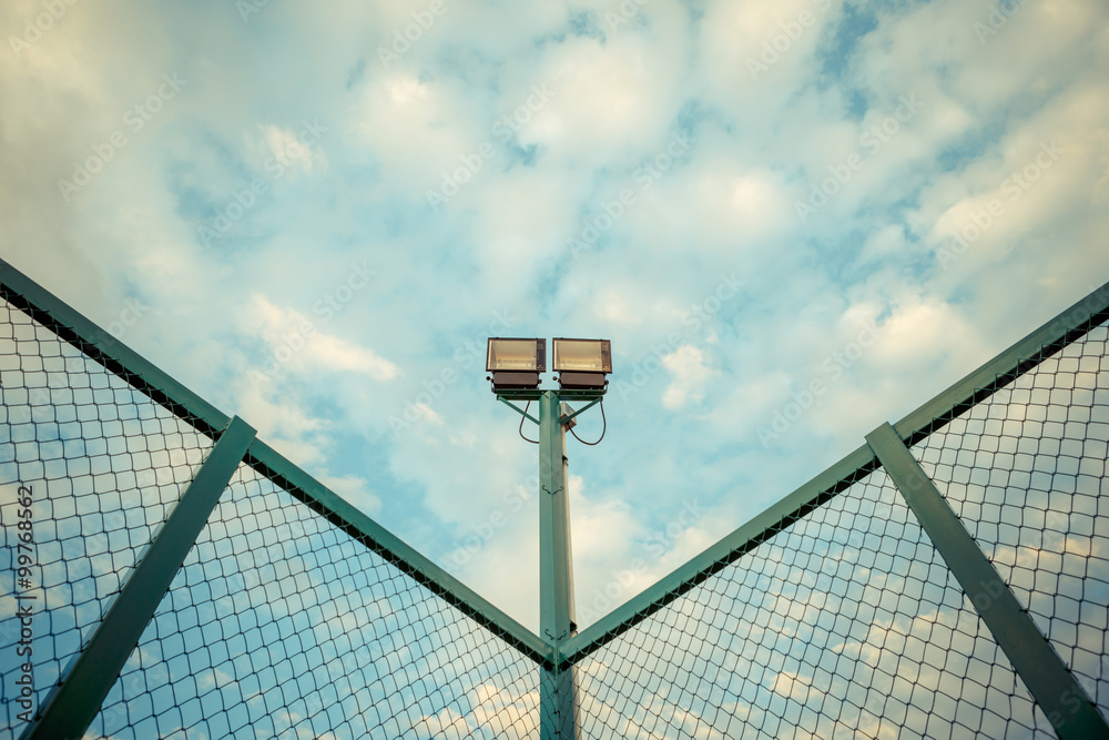 Naklejka premium stadium lights under blue sky with pastel tone