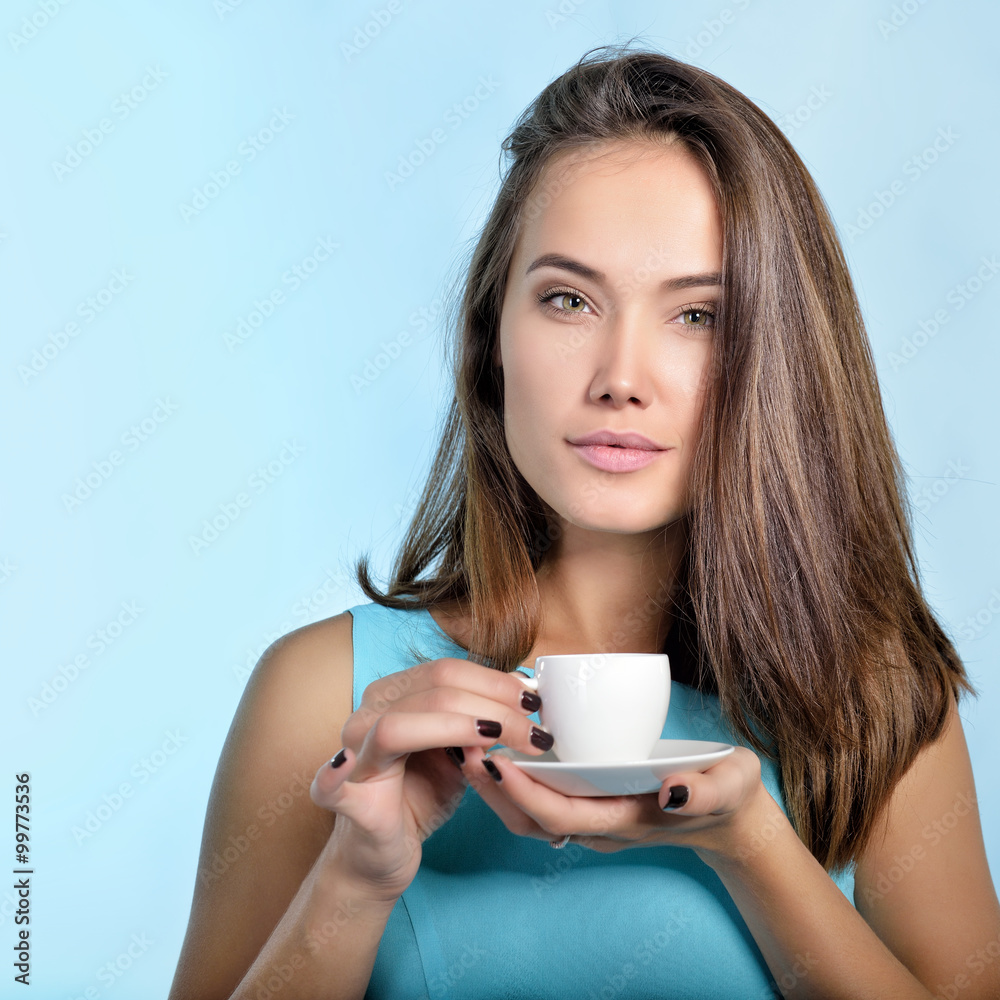 Fototapeta premium Amazing woman holding cup of coffee. Perfect female beauty.