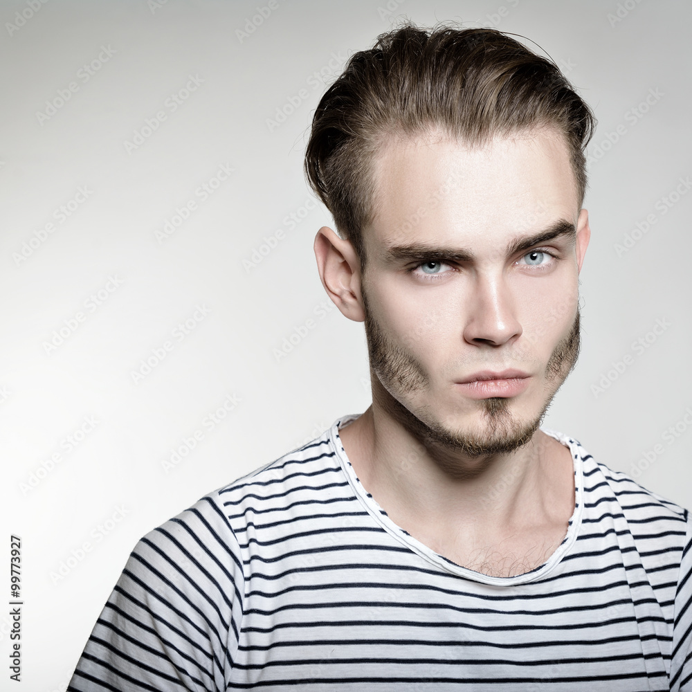 Fototapeta premium Portrait of young man, image toned.