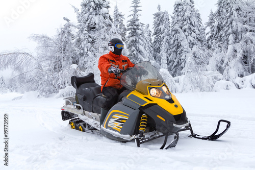 Athlete on a snowmobile.