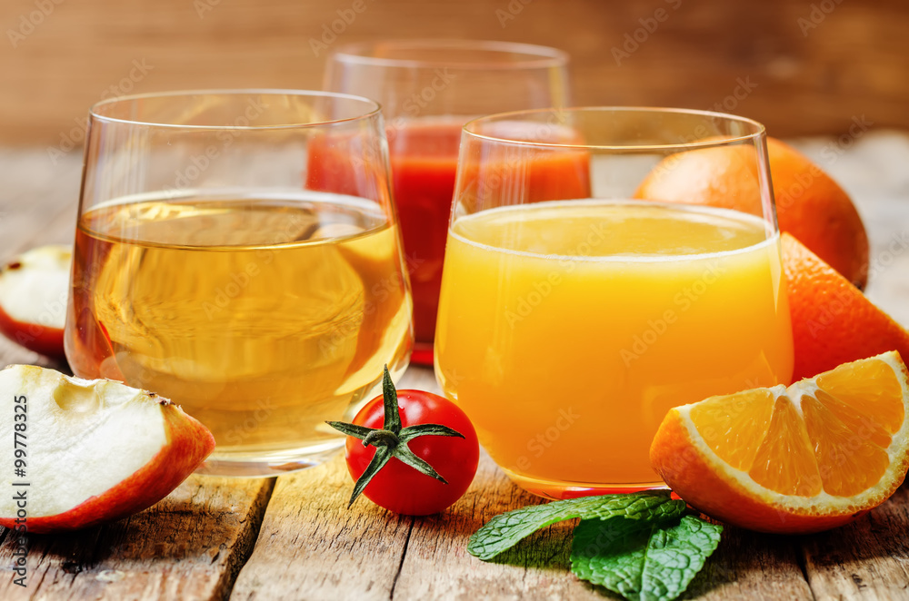 set of juices: orange, tomato and apple set of juices: orange, tomato and apple