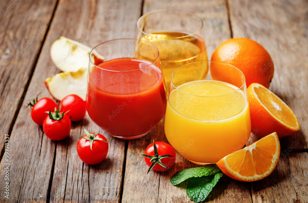 set of juices: orange, tomato and apple set of juices: orange, tomato and apple
