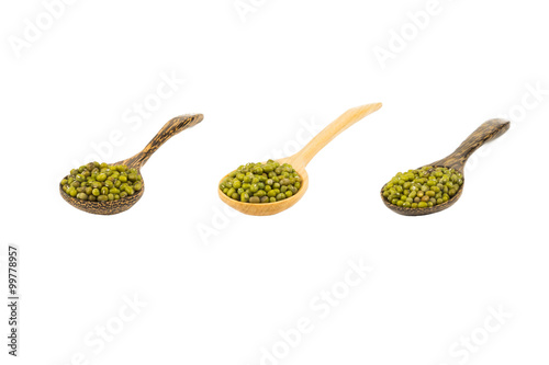 plenty of mung beans on wooden spoon isolated on white