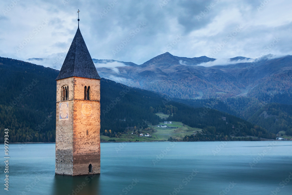 Famous Bell Tower of the Sunken church in Resia Lake, Italy.