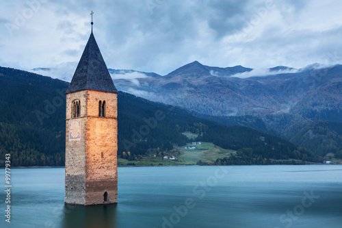 Famous Bell Tower of the Sunken church in Resia Lake  Italy.