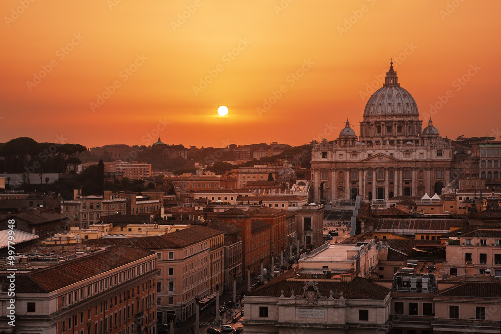 Beautiful sunset over Rome, Italy; St. Peter's Basilica on background.