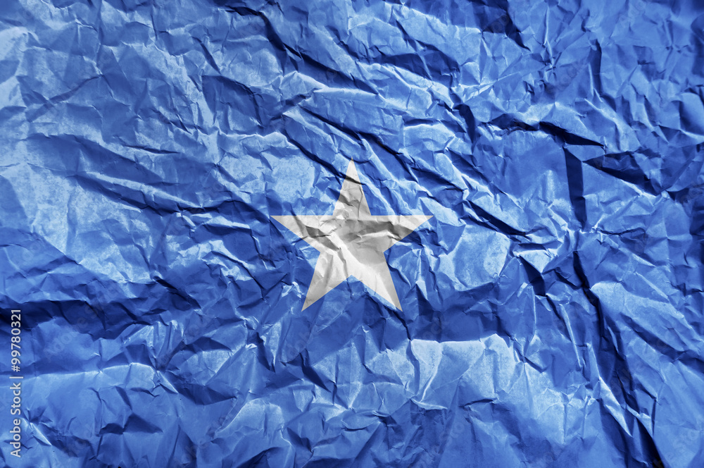 Somalia flag painted on crumpled paper background