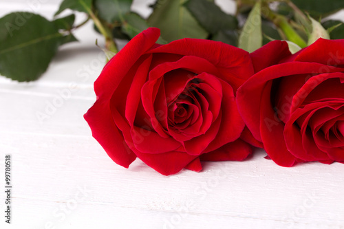 red rose on a white wood background