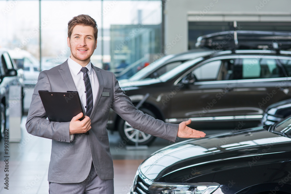 Professional sale assistant working in auto show Professional sale assistant working in auto show