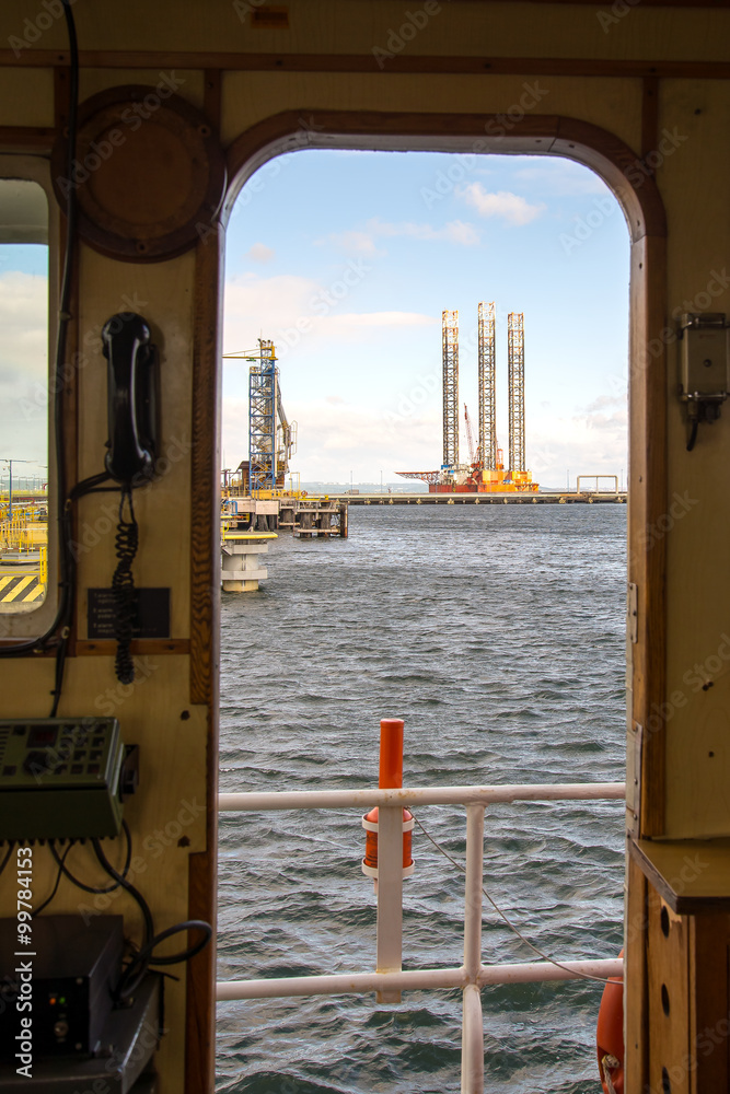 Oil rig A view through the door of the wheelhouse of the vessel on the ...
